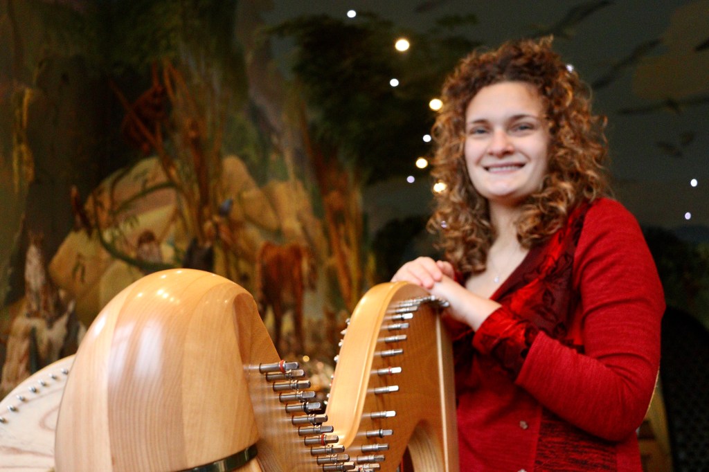 Wedding harpist smiling in Port Lympne Kent wedding venue